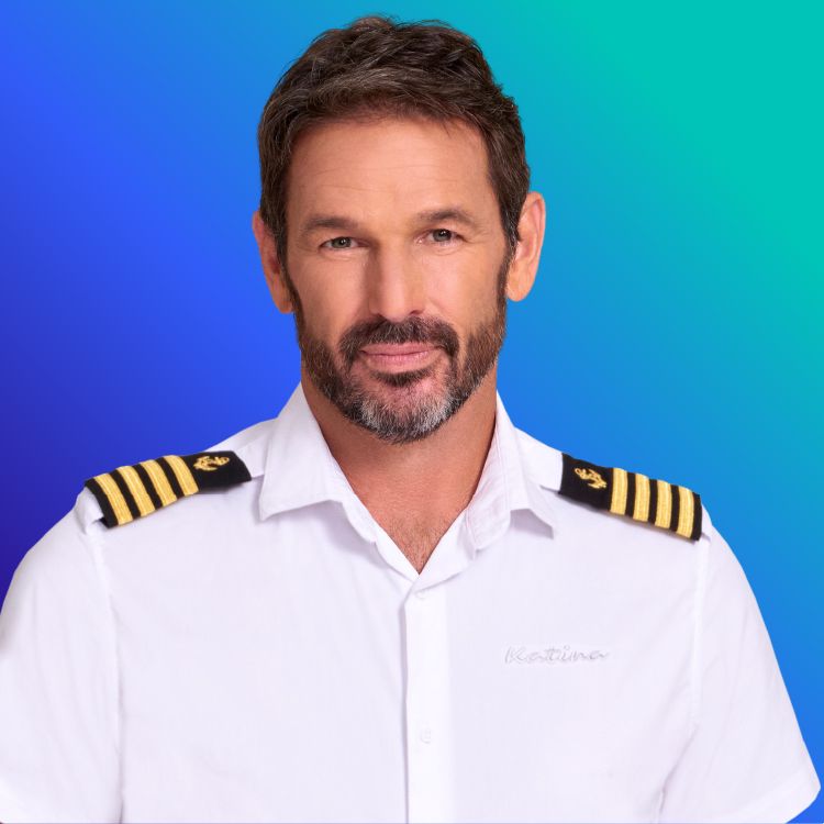 Headshot of Captain Jason Chambers on blue to green gradient background
